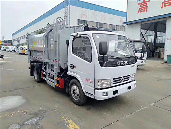 新款東風(fēng)多利卡側(cè)裝壓縮掛桶垃圾車